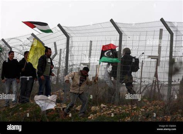 Israeli soldiers take position at Kibbutz Kfar Aza, in southern Israel